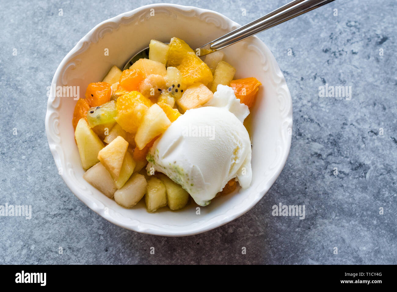 Fruit Salad With Vanilla Ice Cream In Ceramic Bowl Ready To Eat Stock Photo Alamy