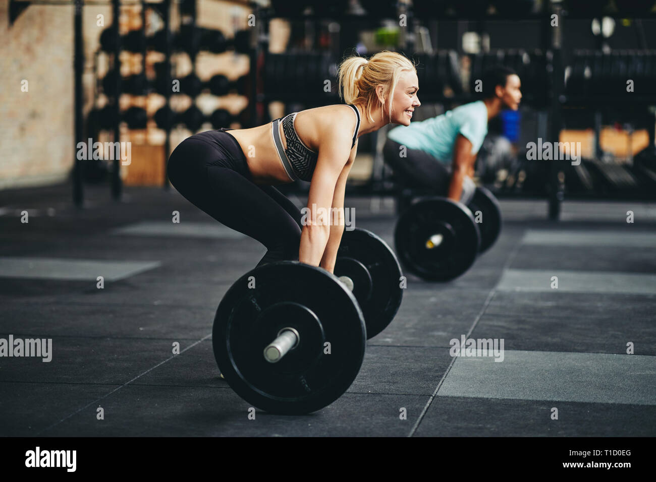 Black woman lifting weights in hi-res stock photography and images - Alamy