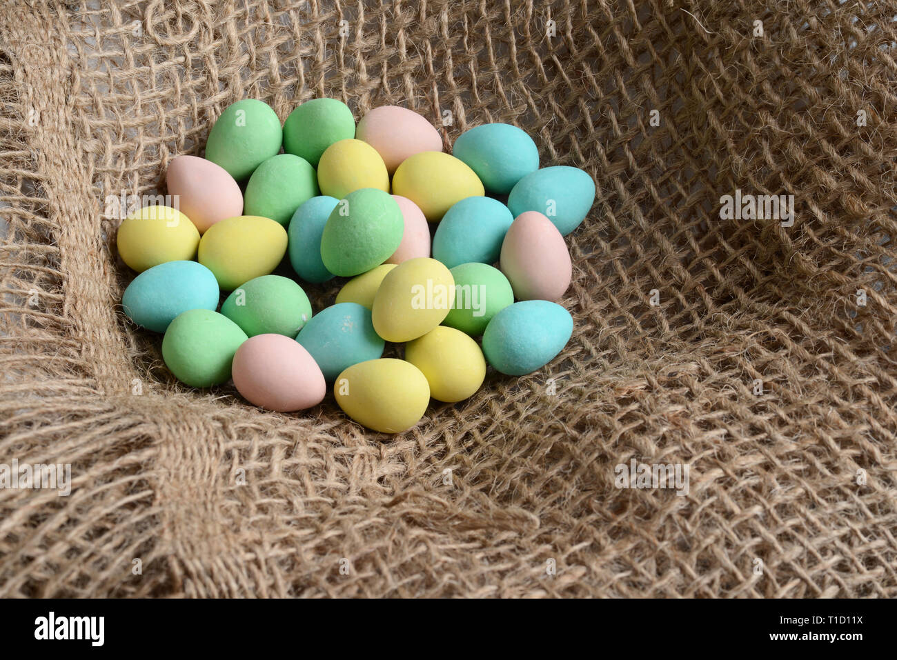 Closeup easter candy eggs in nest Stock Photo