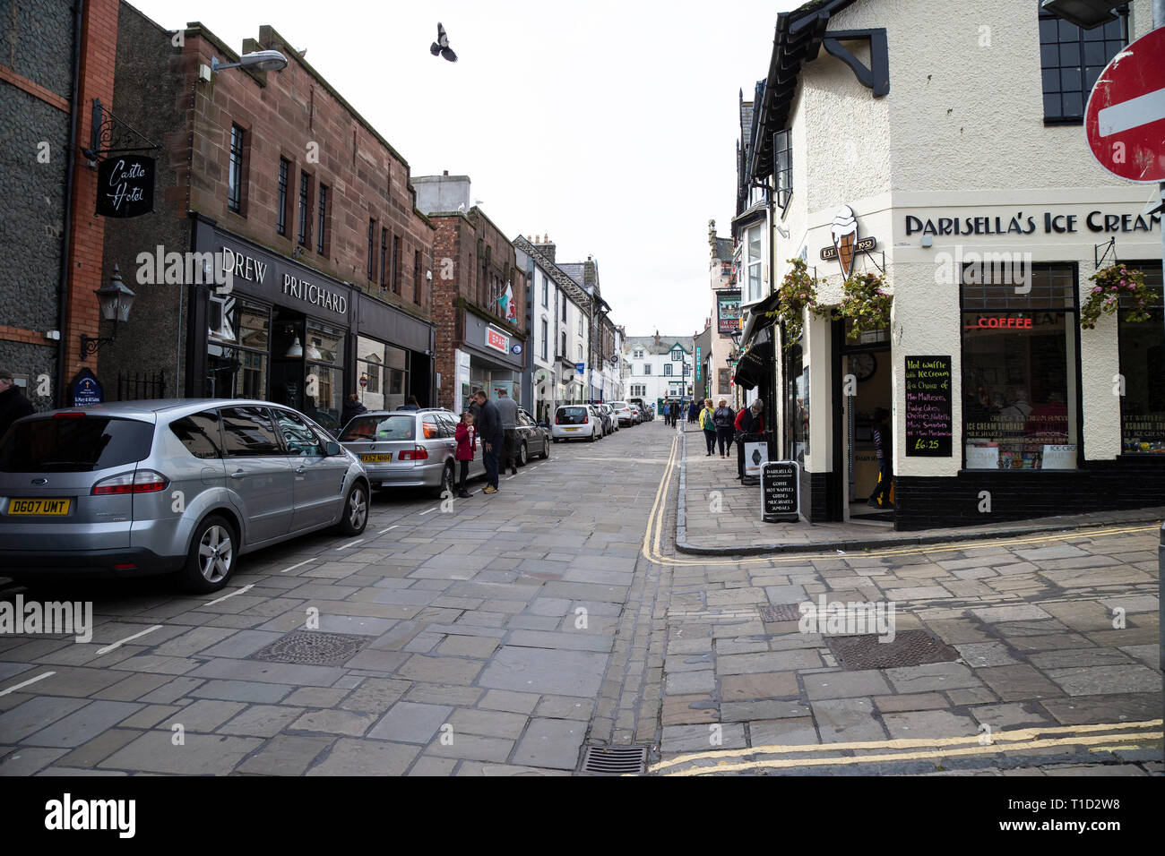 A view looking up Conwy High Street ringed by a circuit of walls from the Quay in North Wales Stock Photo