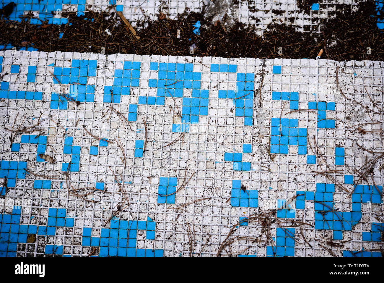 Broken blue azure  retro tiles mosaic in abandoned pool - Berengaria Hotel, Cyprus Stock Photo