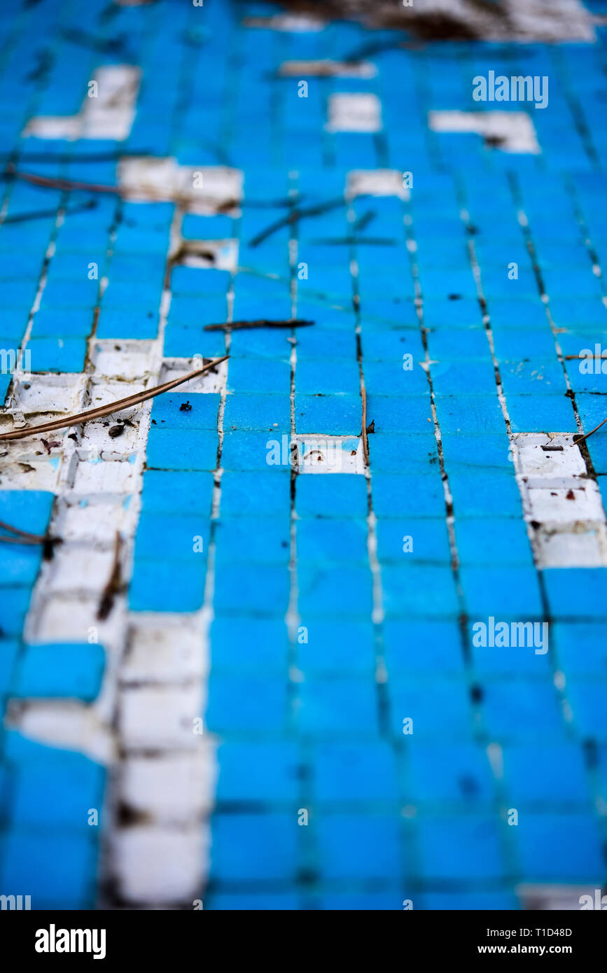 Broken blue azure  retro tiles mosaic in abandoned pool - Berengaria Hotel, Cyprus Stock Photo
