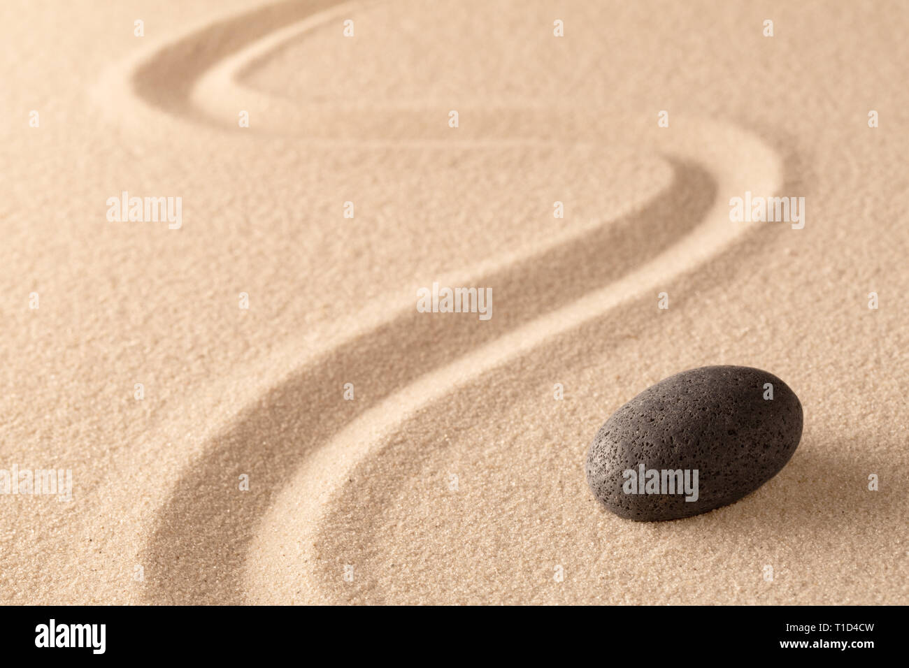 meditation stone in Japanese zen garden. Concept for focus and  concentration to reach spiritual balance, purity and harmony of mind and soul. Spa wel Stock Photo