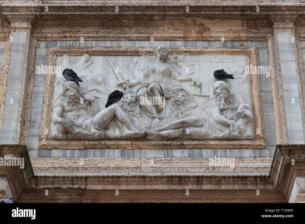 Sculpture at the base of the bell tower of San Marco, Venice Stock Photo