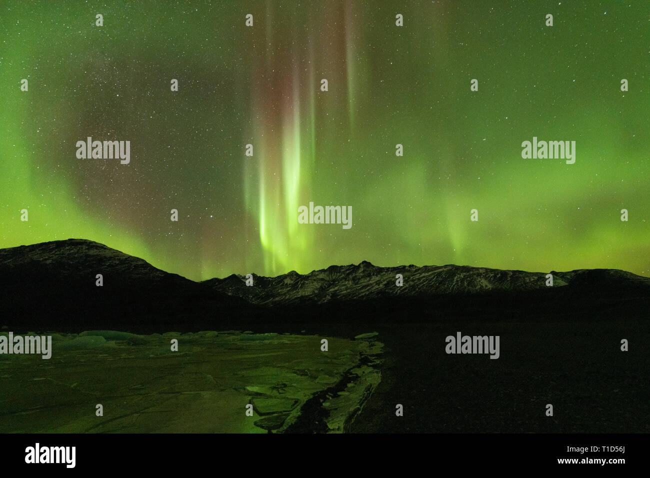 Aurora Borealis over a Frozen Lake, Iceland Stock Photo - Alamy