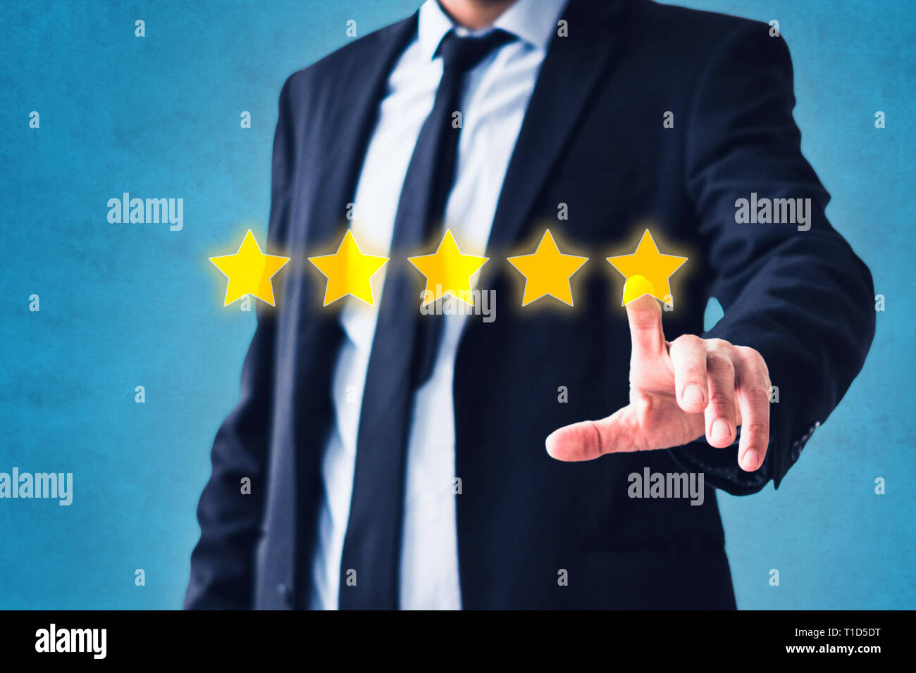 person pointing on 5 star review, costumer feedback concept - five stars rating Stock Photo