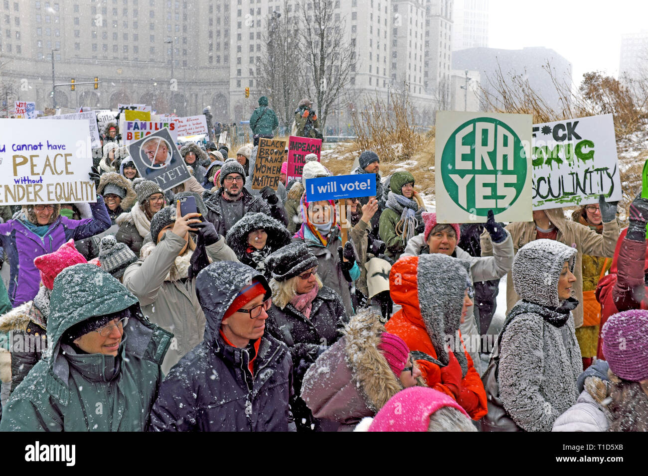 Participants in the 2019 Women's March in downtown Cleveland, Ohio, USA brave a snowstorm as they make their way through Public Square. Stock Photo