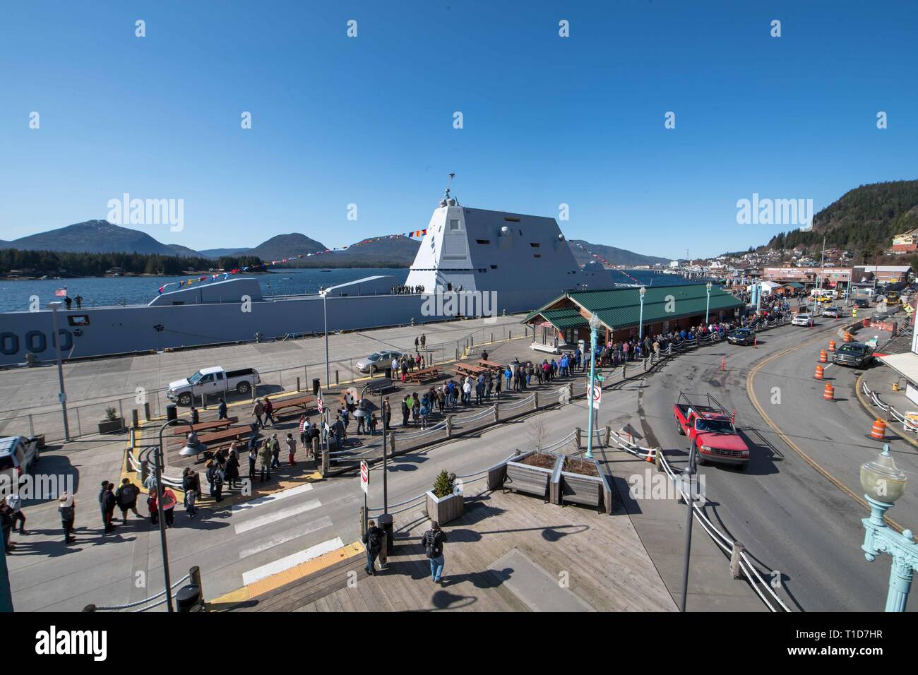 190324-N-DA737-0100 KETCHIKAN, Alaska (Mar 24, 2019) Visitors line up along the pier for a tour of guided-missile destroyer USS Zumwalt (DDG 1000). Zumwalt is conducting the port visit as part of its routine underway operations in the eastern Pacific. Zumwalt-class destroyers provide the Navy with agile military advantages at sea and with ground forces ashore. (U.S. Navy photo by Mass Communications Specialist 2nd Class Jonathan Jiang) Stock Photo