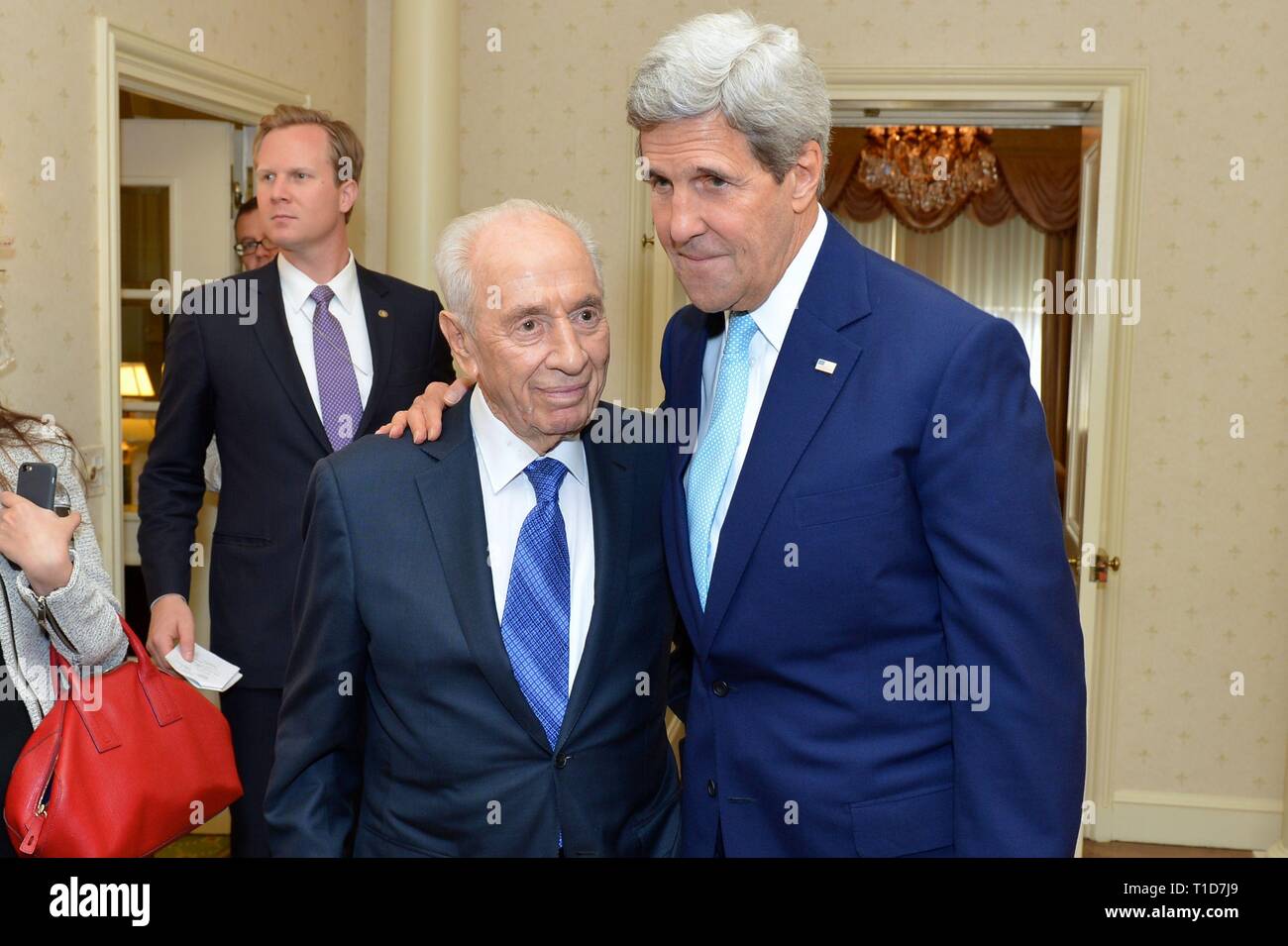 U.S. Secretary of State John Kerry meets with former Israeli President Shimon Peres in New York City on September 22, 2014. The Secretary is holding m Stock Photo