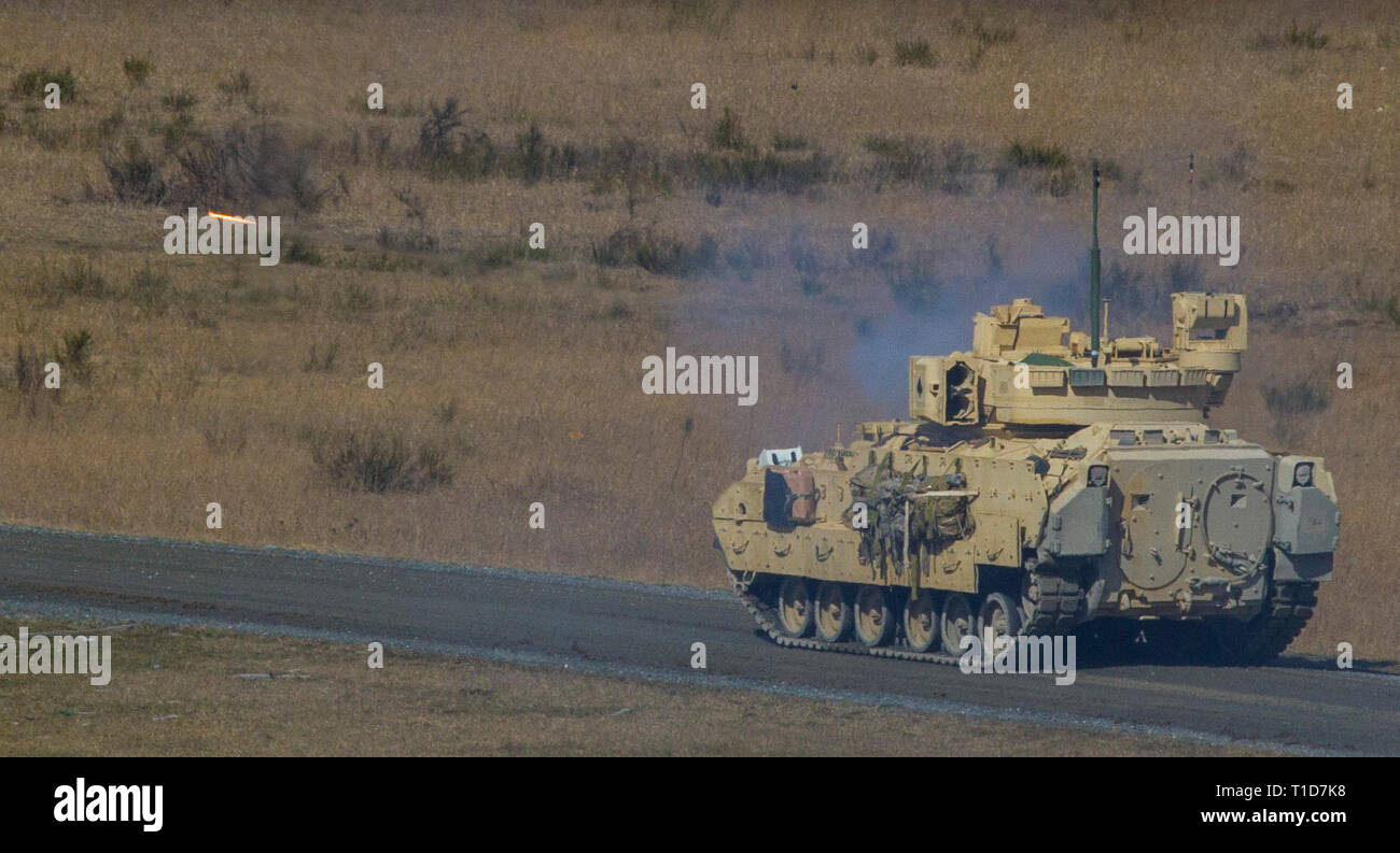 U.S. Army Soldiers with the 2nd Battalion, 34th Armored Regiment, 1st Armored Brigade Combat Team, 1st Infantry Division, fire rounds down range during gunnery training at Grafenwoehr Training Area, Germany, March 19, 2019. This M2A3 Bradley is armed with the Bushmaster 25mm chain-driven autocannon and the coaxial 7.62mm medium machine gun. (U.S. Army photo by Spc. Yon Trimble) Stock Photo