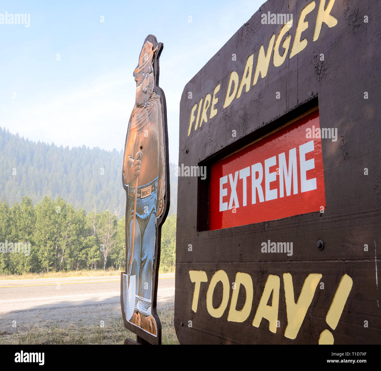 A road side Smokey Bear sign continues to tell motorists that the fire conditions are 'Extreme' today, during the Beaver Creek Fire at Sawtooth Nation Stock Photo