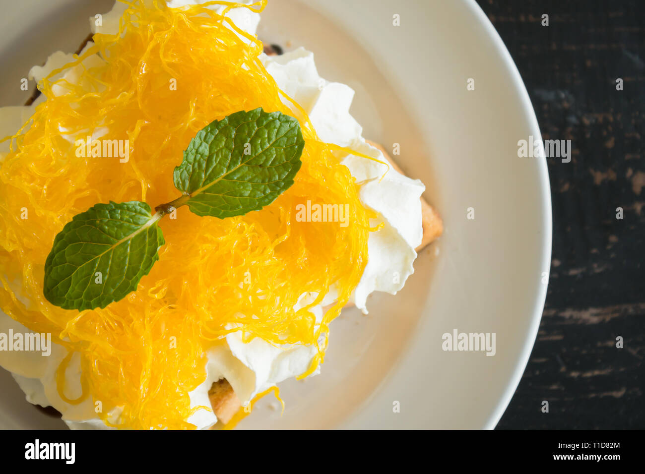 Golden Egg Yolk Threads or Foi Thong Toast and Whipped Cream and Chocolate. Thai dessert golden