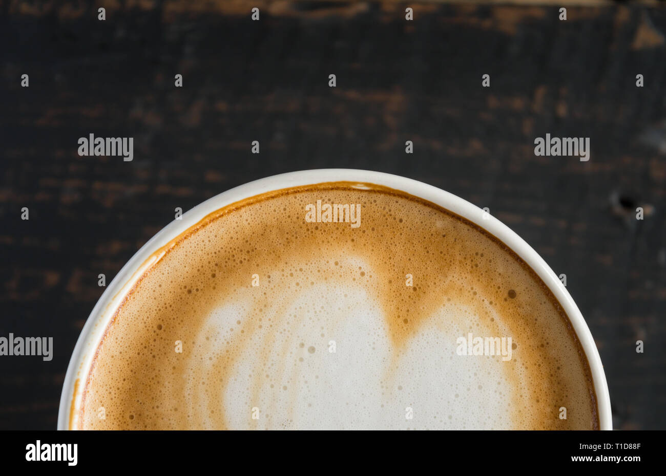 Nice Texture of Latte art on hot latte coffee . Milk foam in heart