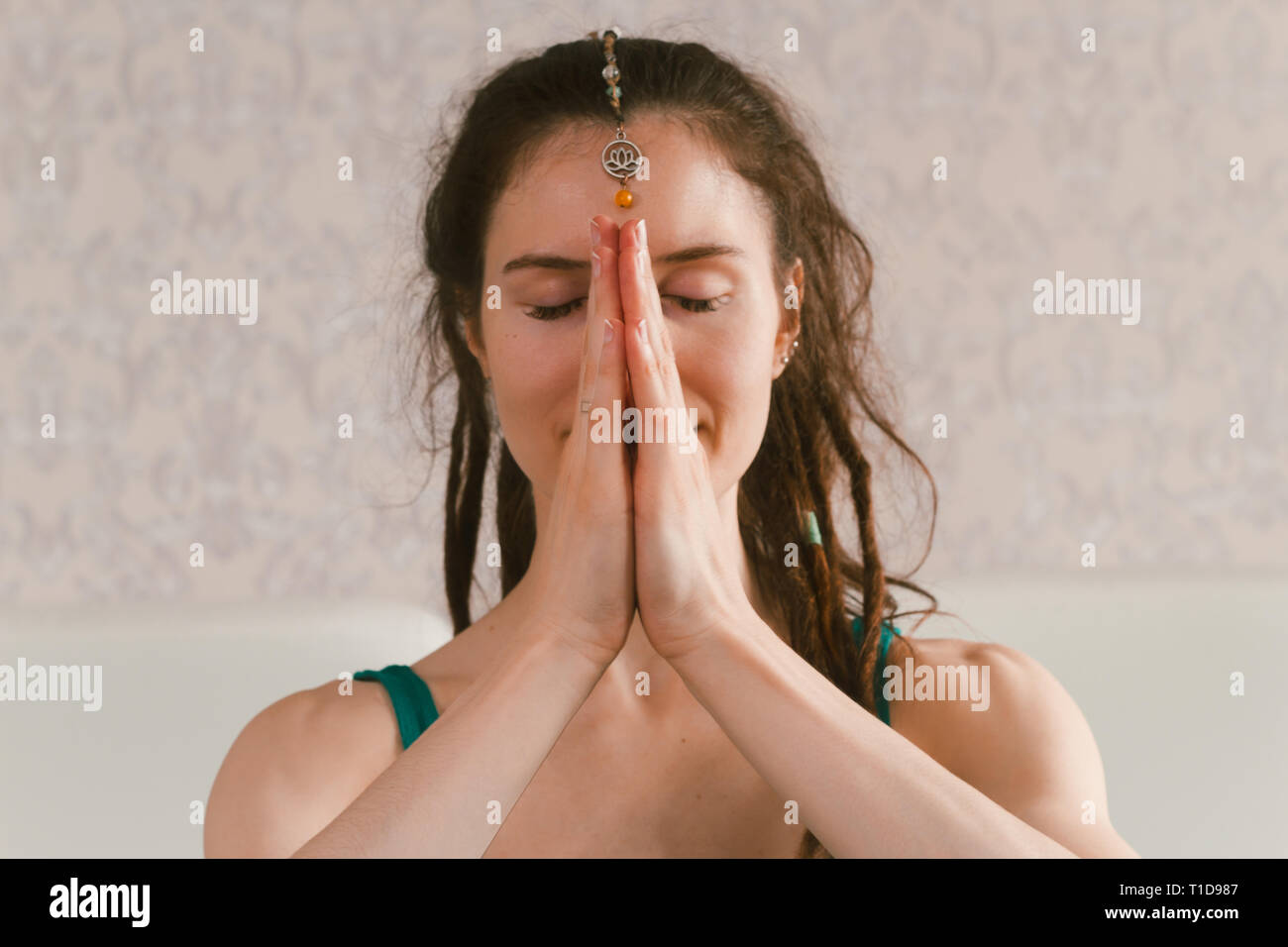 beautiful young woman sitting on bed, morning yoga in bed, beauty and