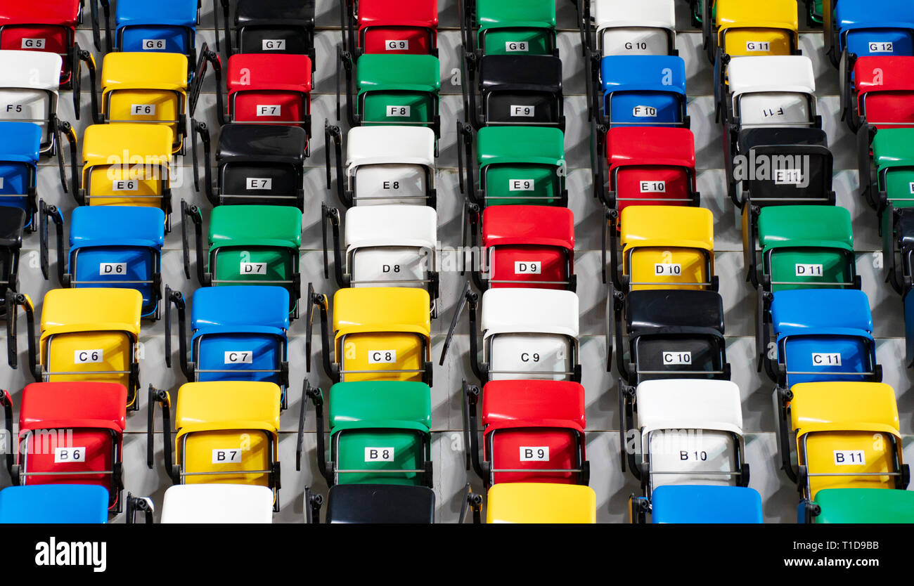 Rows of an empty colourful plastic seats Stock Photo