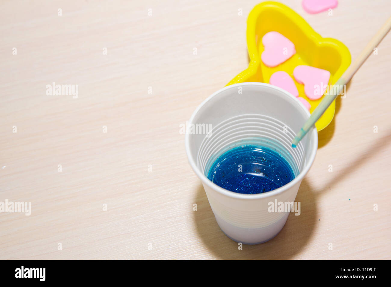 Process of homemade soap, mixing lye solution into oil. Making a gift