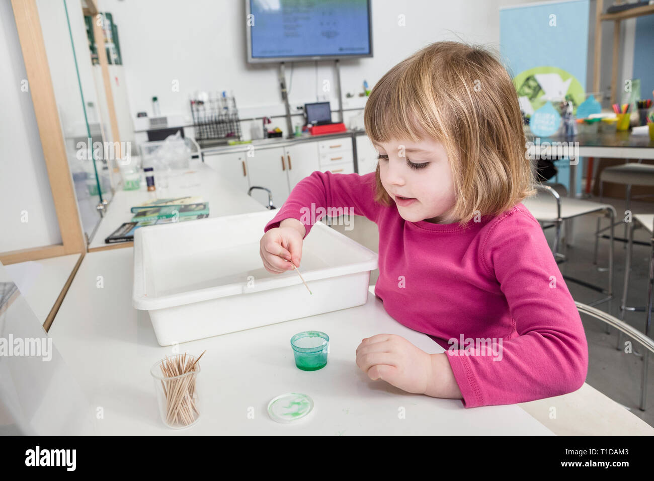 Young girl doing science experiments at a laboratory. Stock Photo