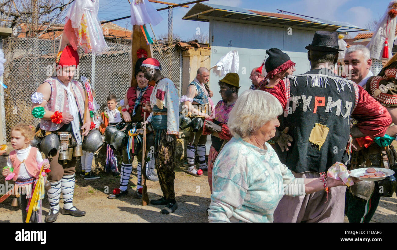 Turia, Bulgaria, 9 March 2019. Masquerade ritual Kukeri  to expel evil.  People from the village wear big bells and terrible costumes. Stock Photo