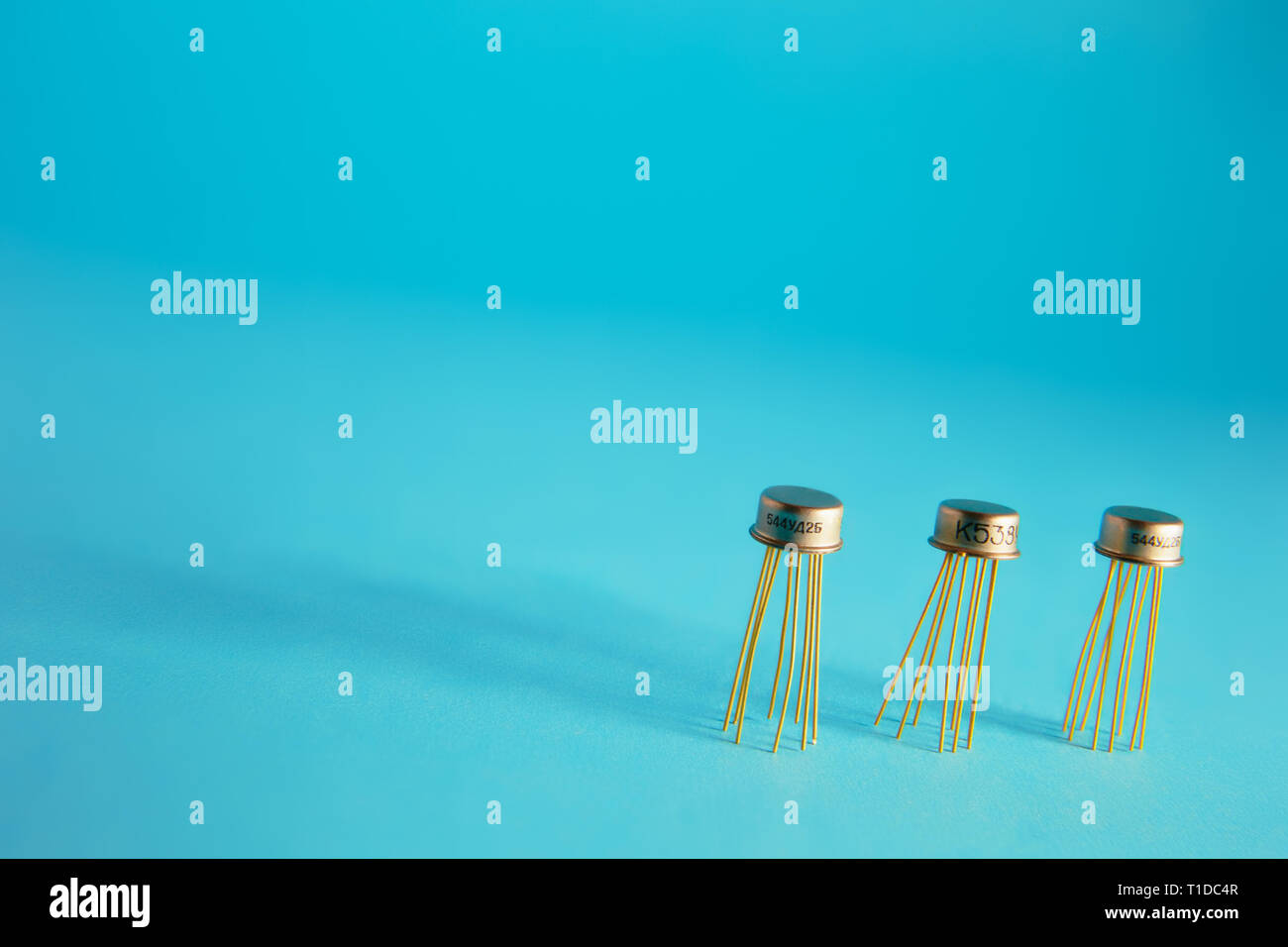 radio components and microcircuits on a blue background, long shadows Stock Photo