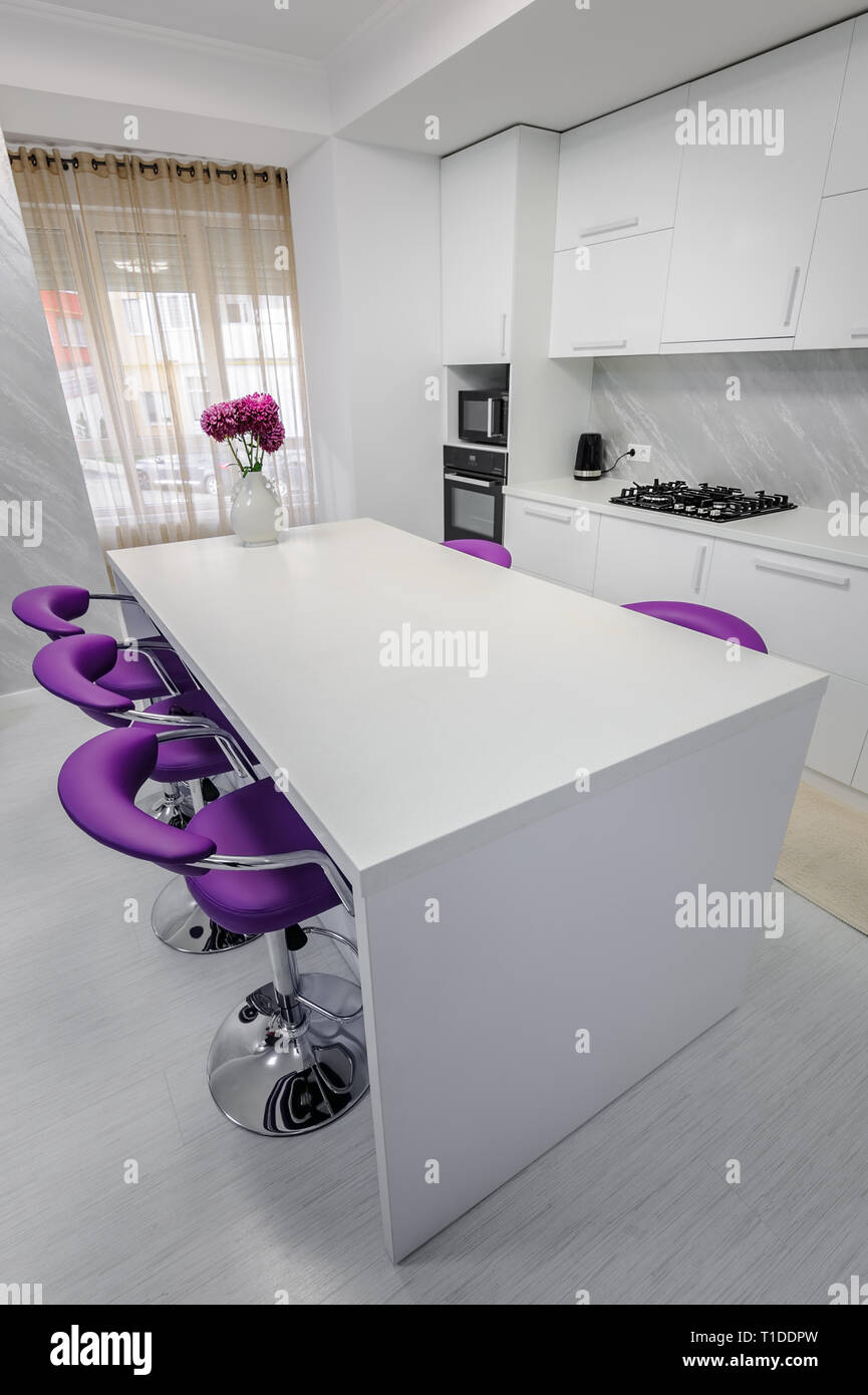 white dining table in modern kitchen Stock Photo - Alamy