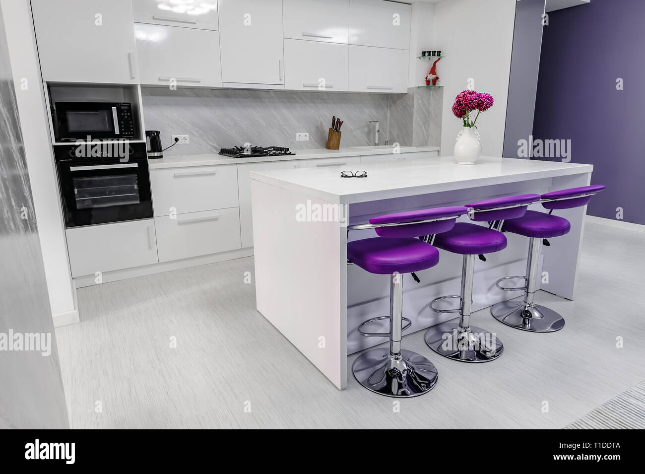 white dining table in modern kitchen Stock Photo - Alamy