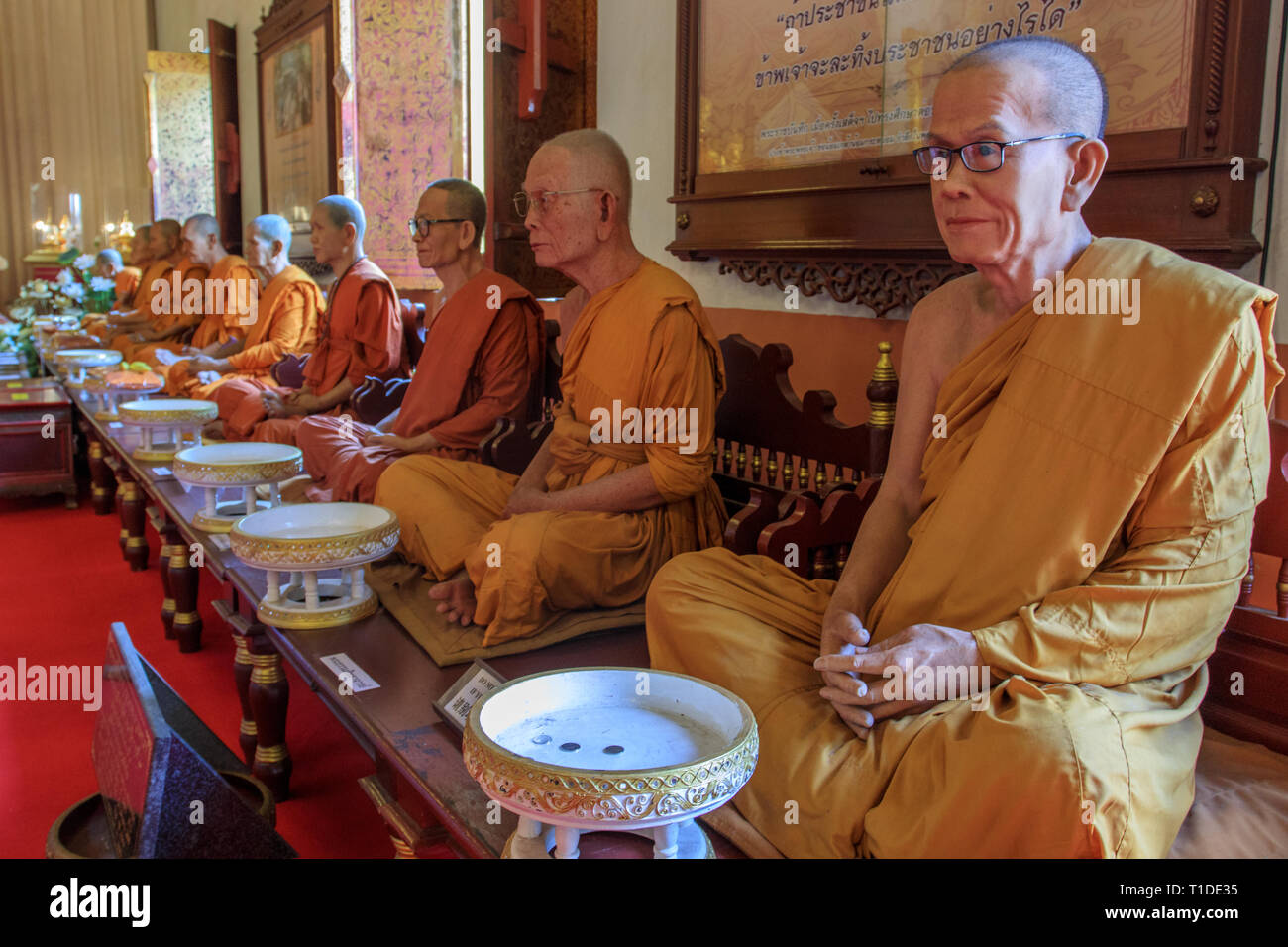 Realistic statues of famous Thai monks at Wat Phra Sing Stock Photo
