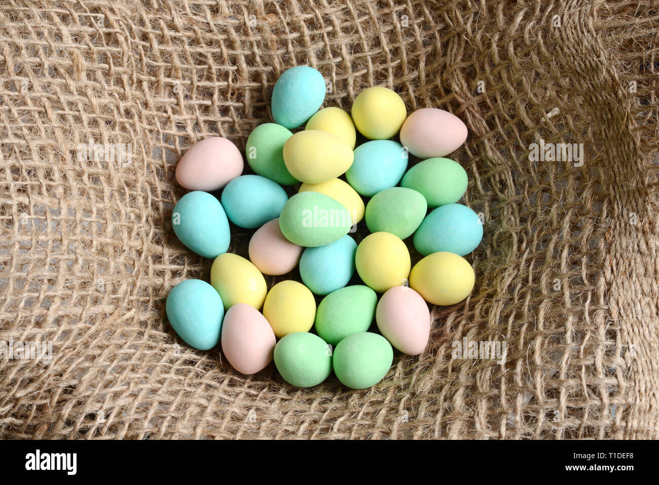 Closeup top view easter candy eggs in nest Stock Photo