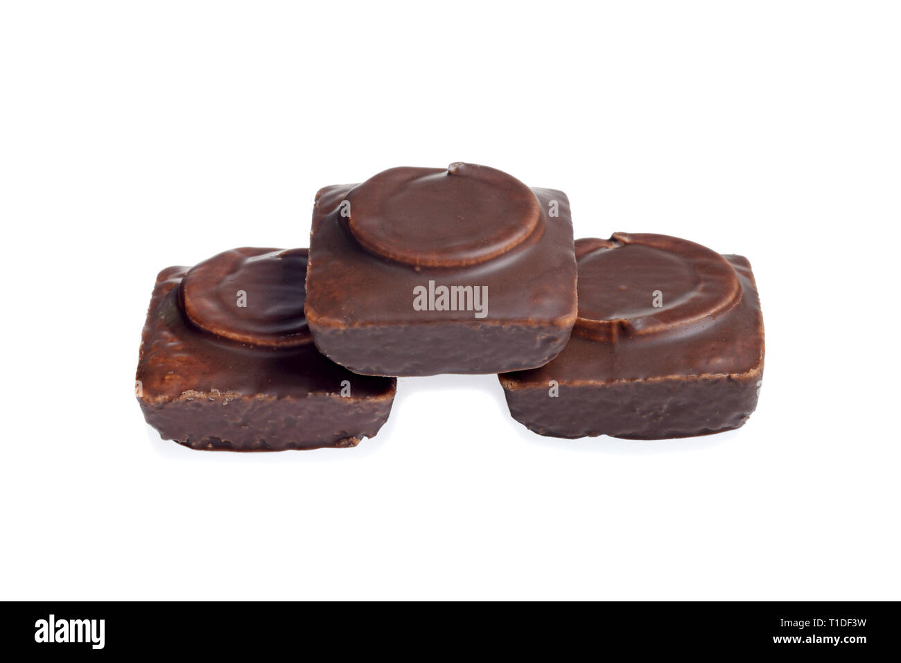 three chocolate covered small cakes Stock Photo