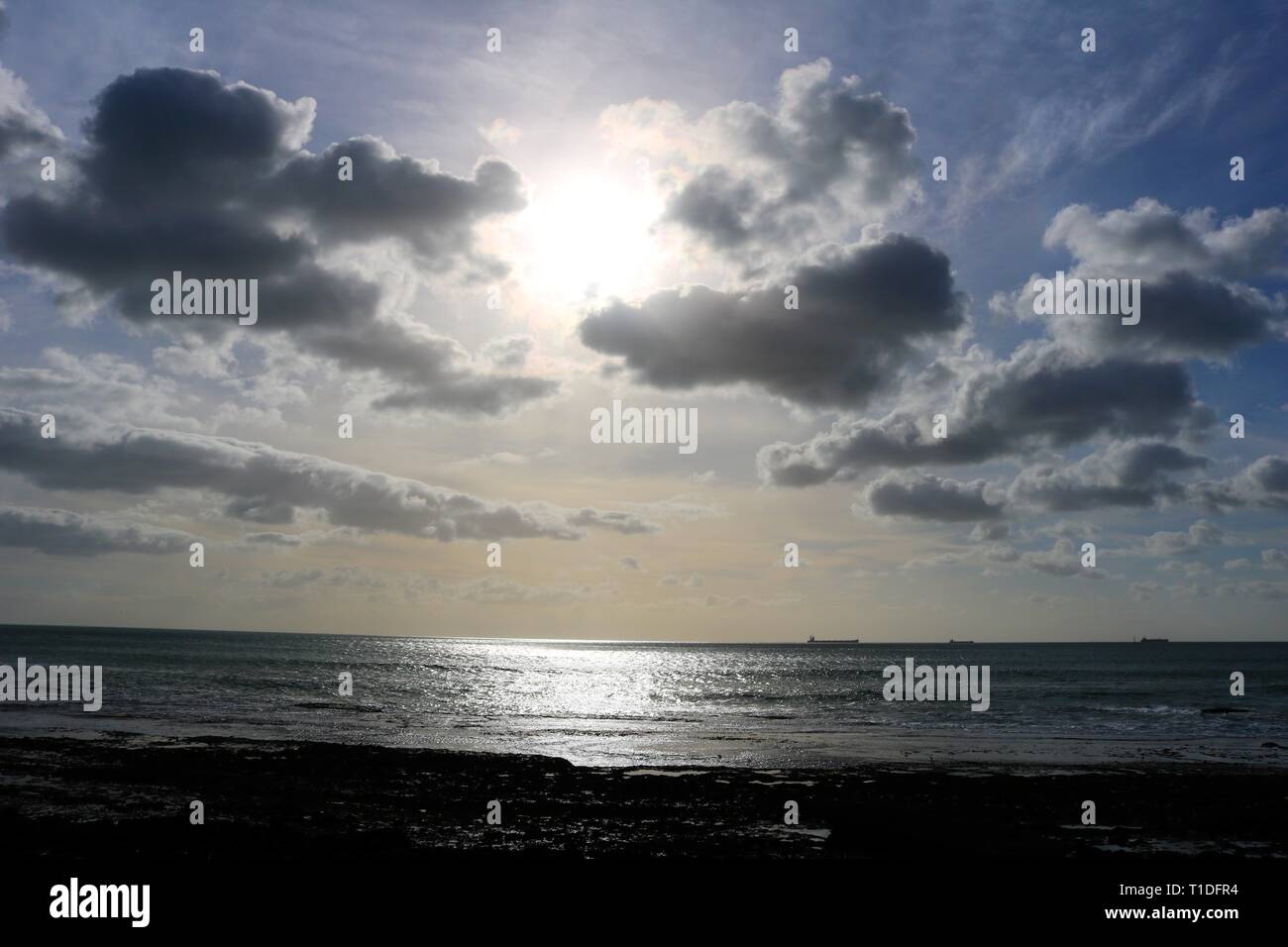 Sun going down on the ocean Stock Photo