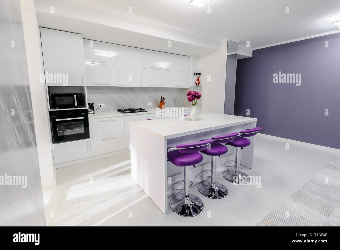 white dining table in modern kitchen Stock Photo - Alamy