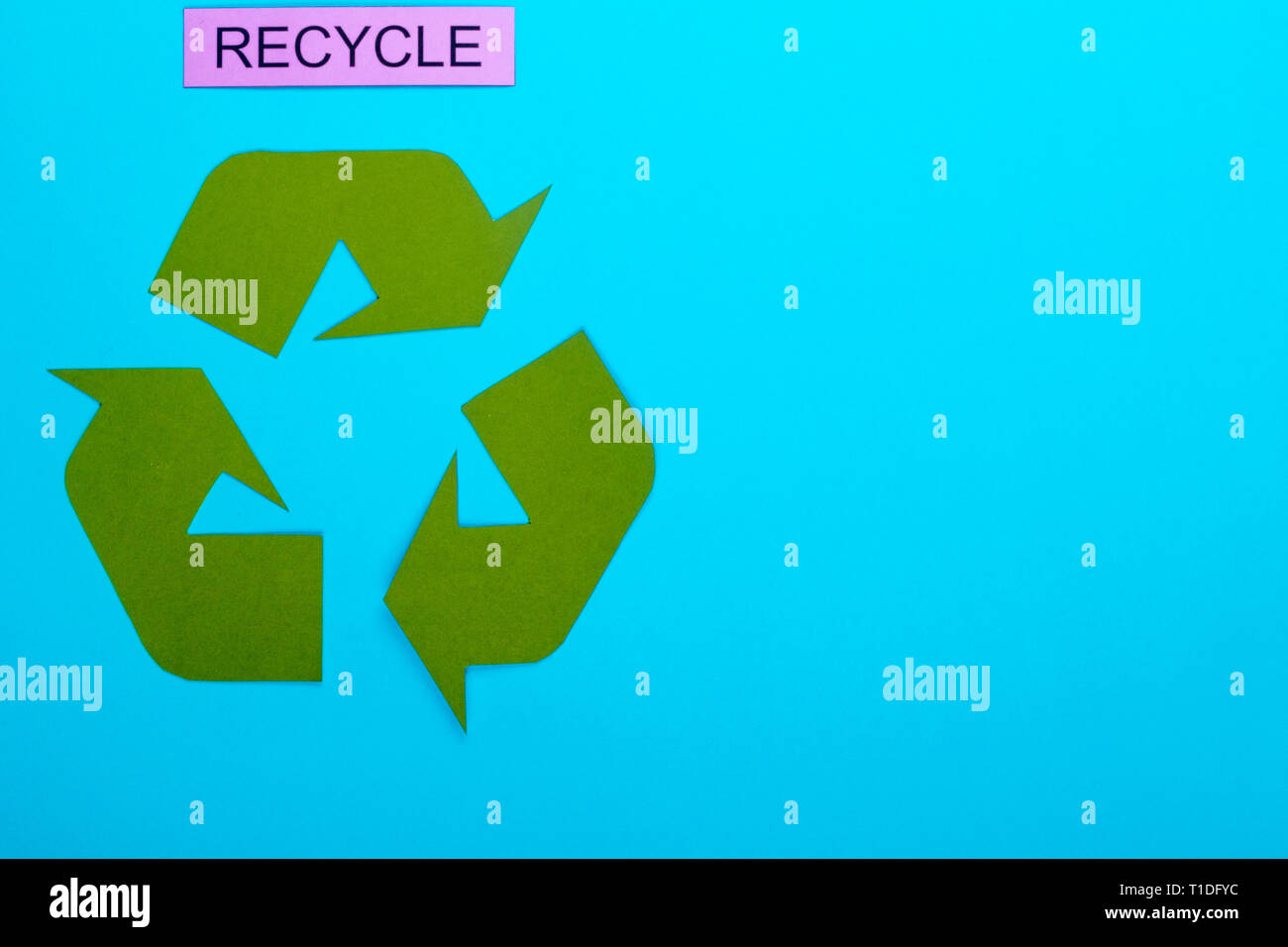Recycle concept showing the green recycle logo with recycle on a blue background Stock Photo Alamy