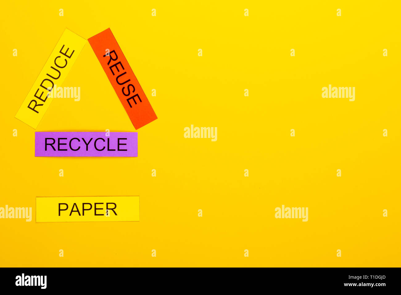 Recycling concept showing reduce, reuse & recycle with paper on a ...