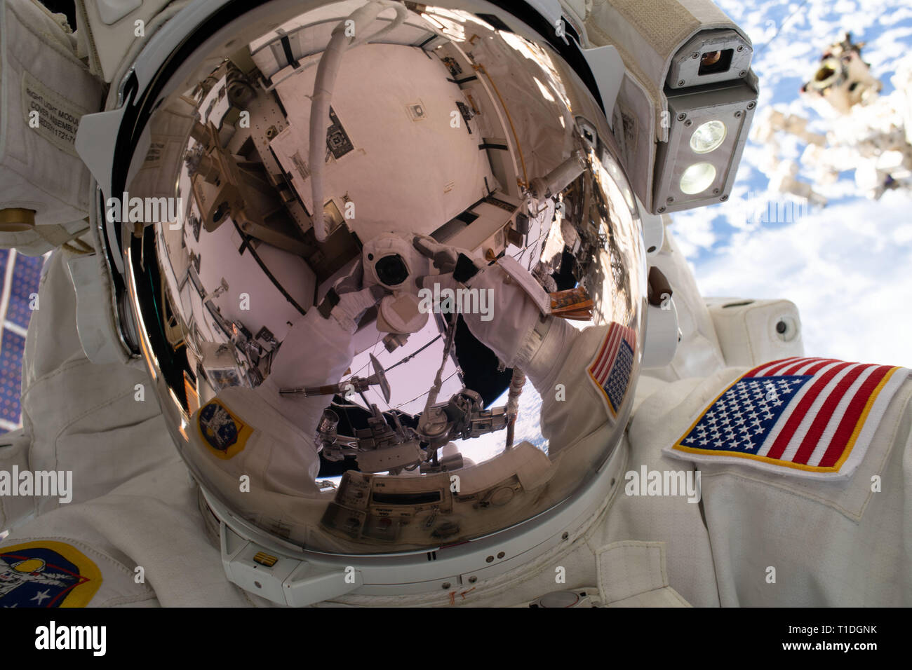 Expedition 59 NASA astronaut Nick Hague takes a selfie while working on the power supply during a spacewalk outside the International Space Station March 22, 2019 in Earth Orbit. Astronauts McClain and Hague spent six-hours and 39-minutes outside the space station to upgrade the orbital complex's power storage capacity. Stock Photo