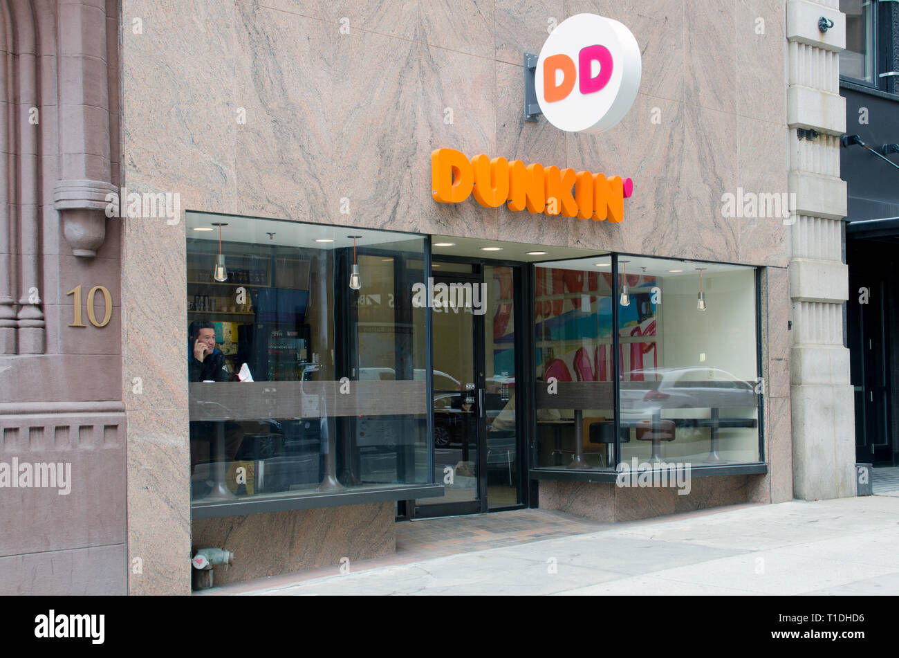 Dunkin Donuts store in Boston, Massachusetts USA with new branding of name being just Dunkin Stock Photo