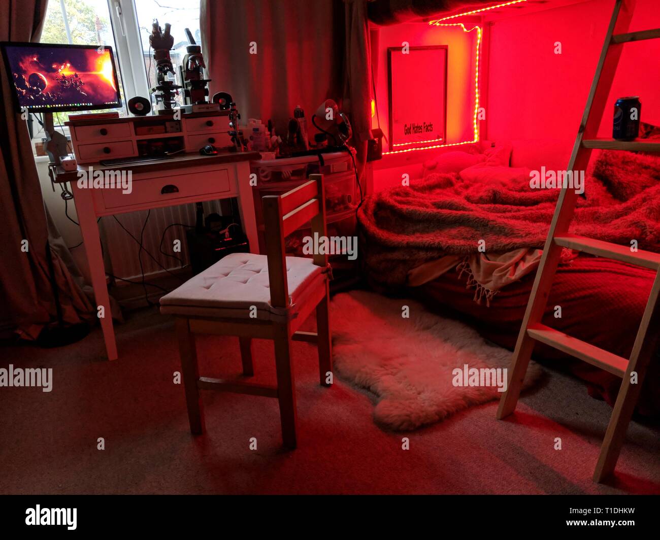 A bedroom bathed in red light Stock Photo