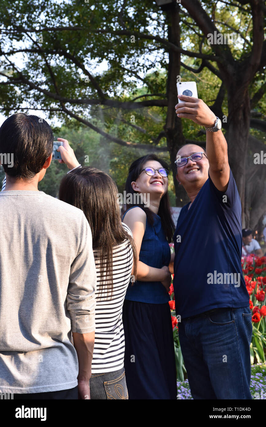 People taking selfies, Chiang Mai Stock Photo