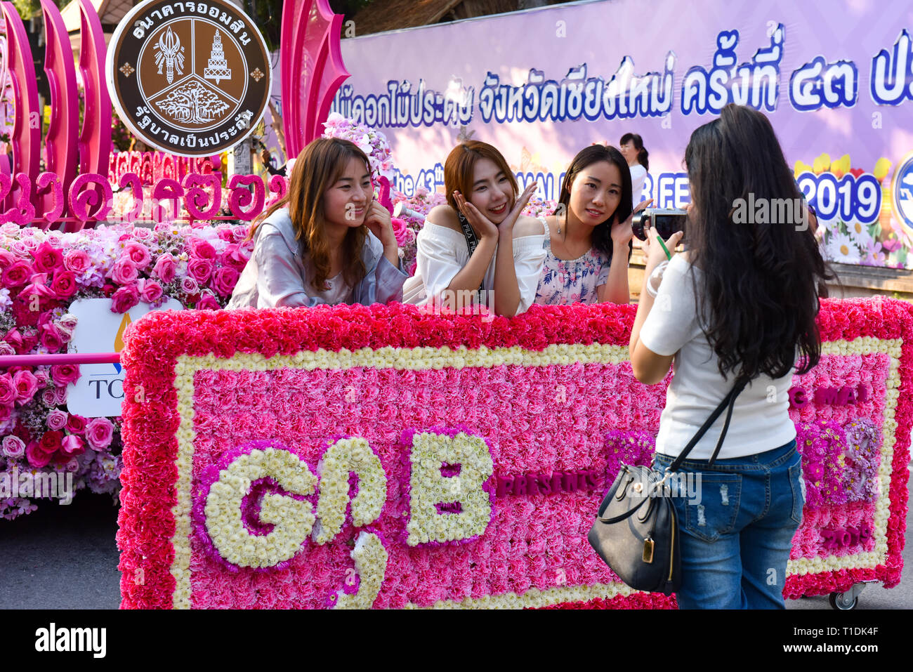 Asian girls posing during the Flower festival in Chiang Mai Stock Photo