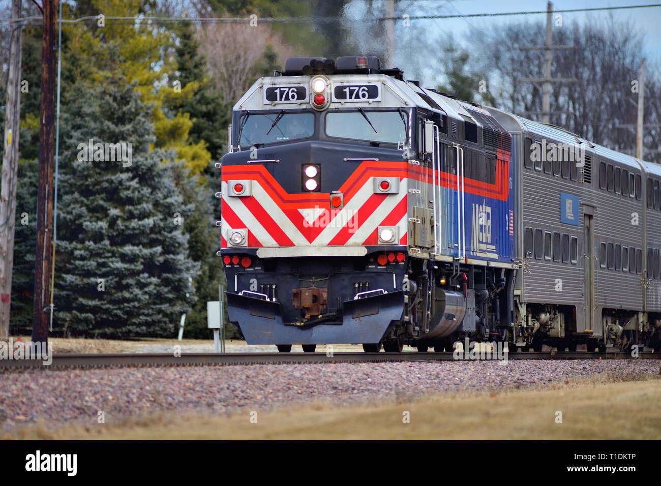 Geneva, Illinois, USA. A Metra locomotive leading a commuter train from Chicago through Geneva, Illinois. Stock Photo
