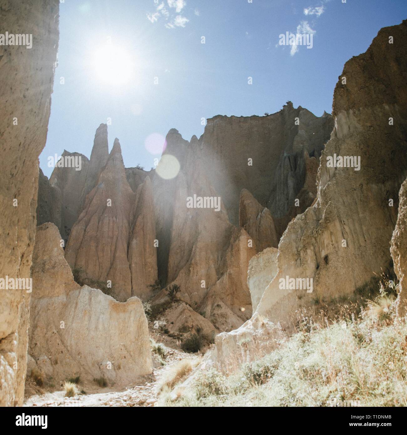 The sun shining into the Clay Cliffs in Omarama, NZ Stock Photo