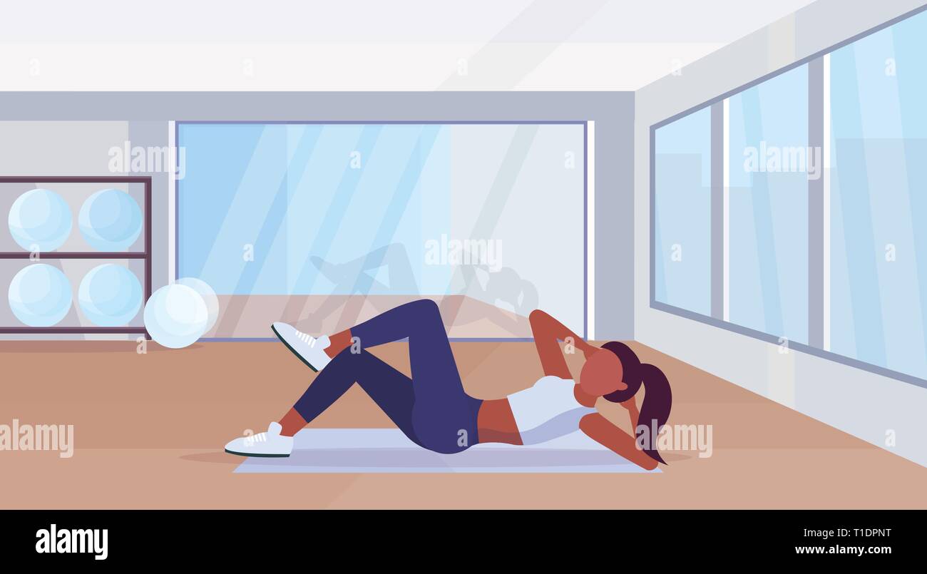 sports woman doing press exercises on mat african american girl