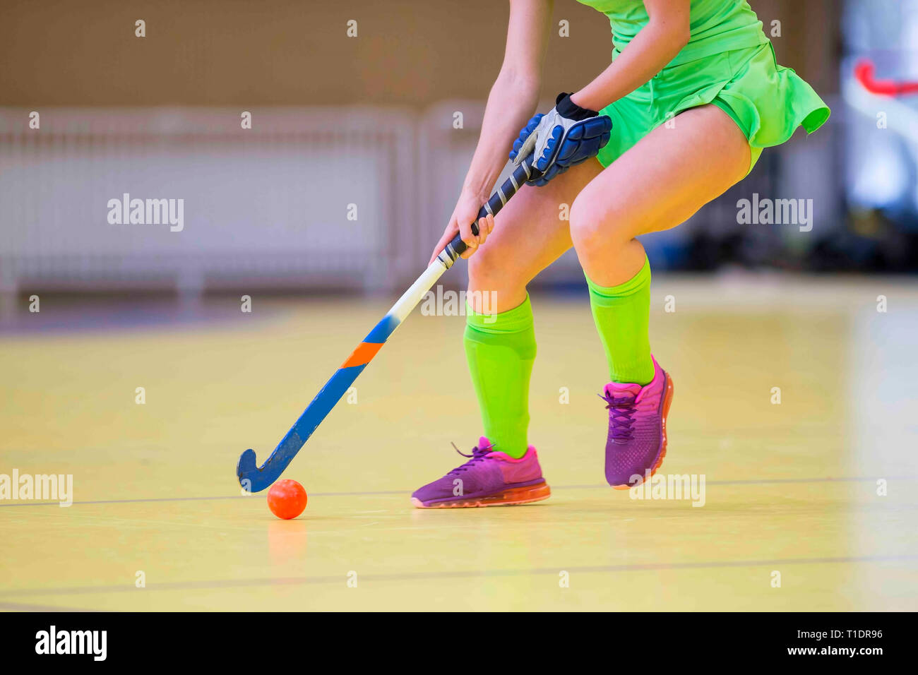 Young hockey player woman with ball in attack playing field hockey game  Stock Photo - Alamy