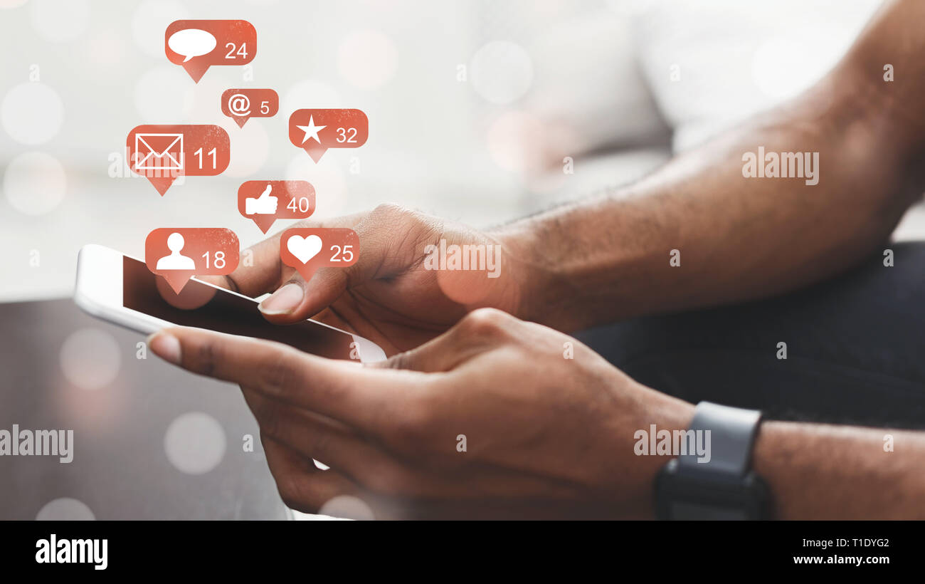 Social media. Man holding smartphone, connecting to internet Stock Photo