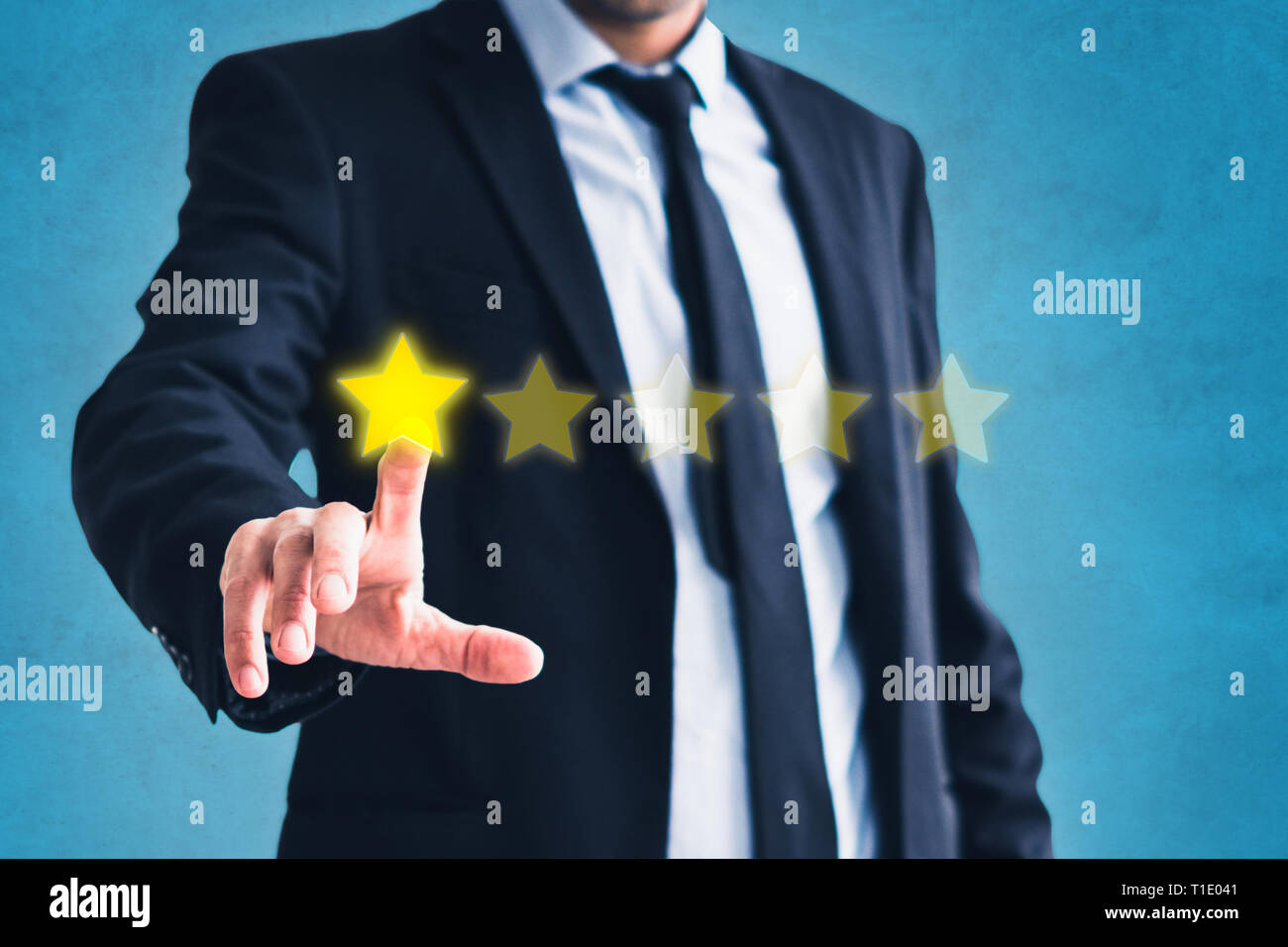 bad review, businessman gives one of five stars - negative costumer feedback Stock Photo