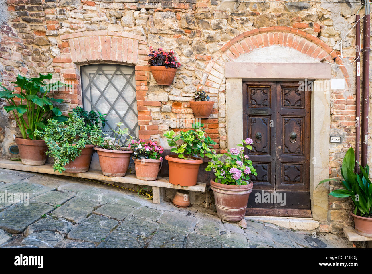 Detail of stone houses in an alley of an ancient Tuscan village in ...