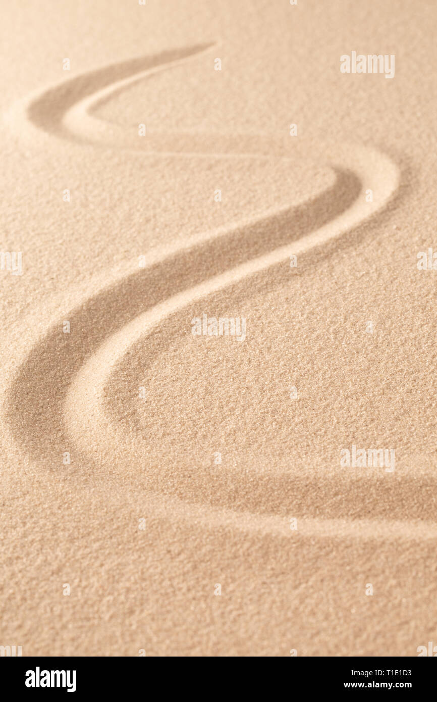 Sand texture background with line pattern. Minimal zen meditation garden. Concept for yoga, spa wellness or buddhism and mindfulness.  With copy space Stock Photo