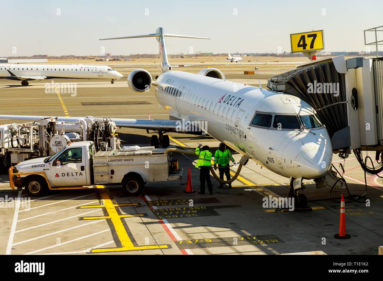FEB 14, 2019 JFK NEW YORK, USA Small jet airplane with attached at