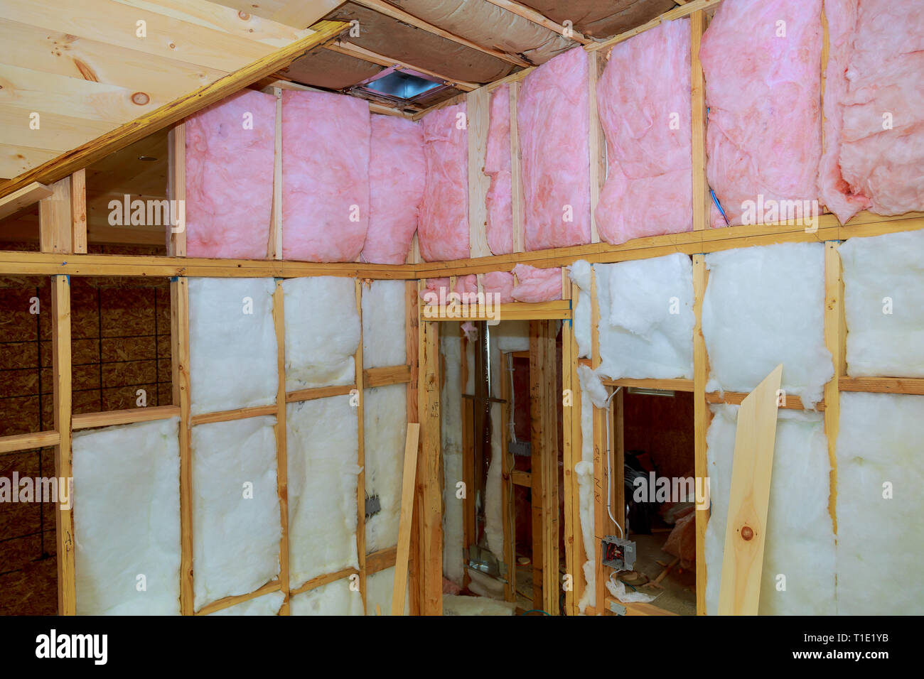 Wooden frame for future walls insulated with rock wool and fiberglass insulation home, construction and renovation concept. Stock Photo