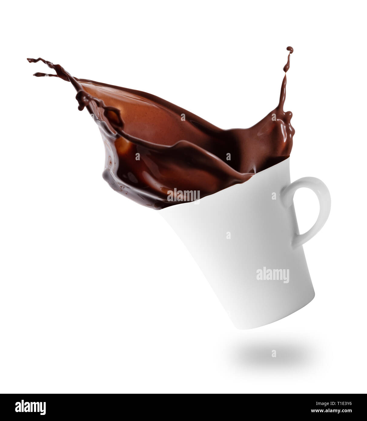 Hot chocolate splashes out of tilted white cup Stock Photo
