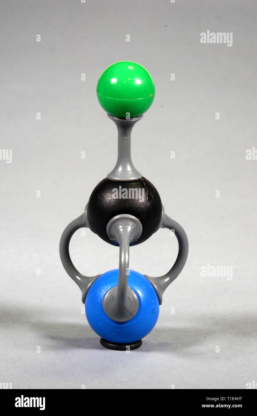 Molecule model of potassium cyanide. Green = Potasstium, black = Carbon, blue = Nitrogen. Stock Photo