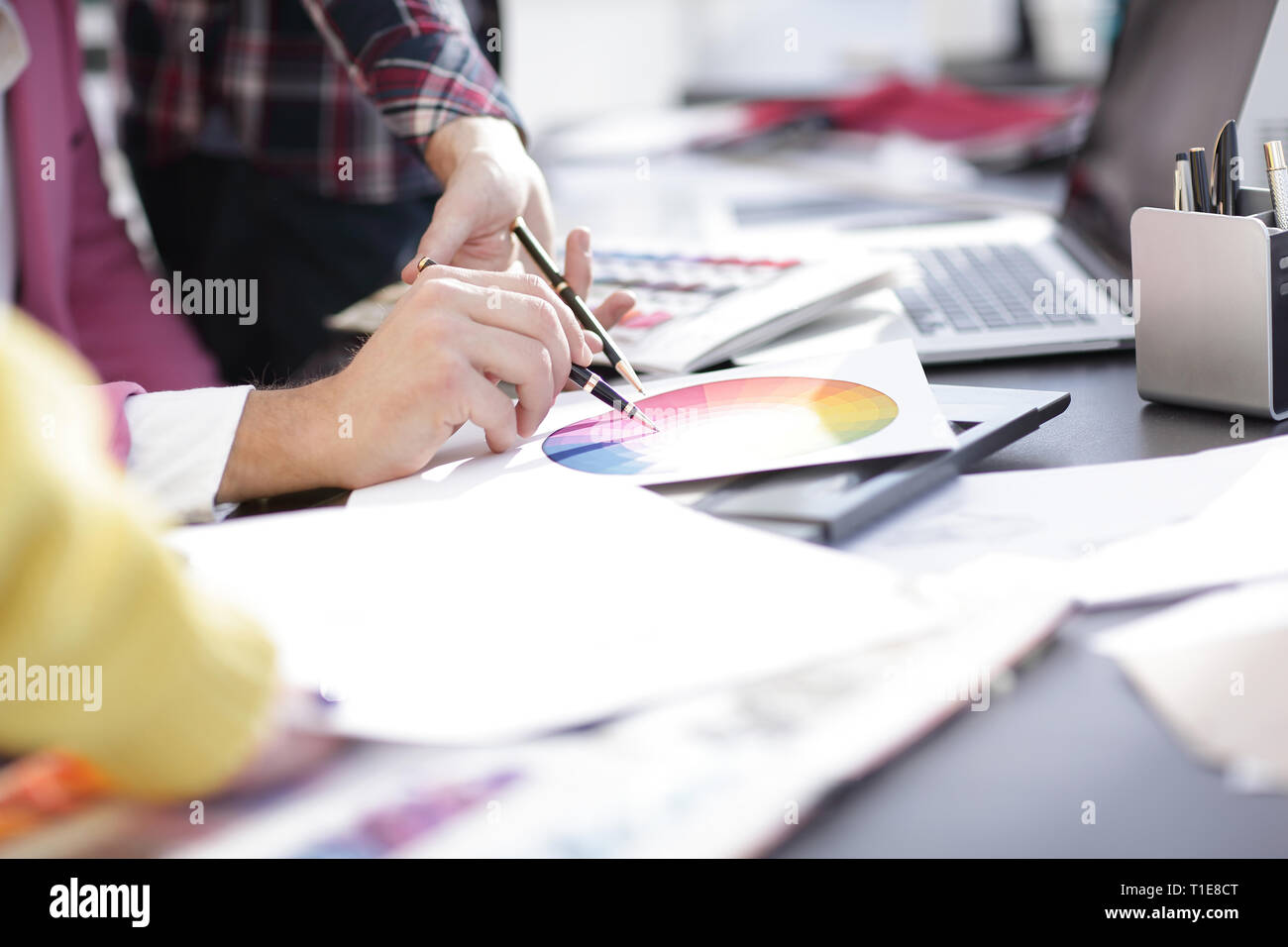 close up.designer working at office Desk with blueprints for a new